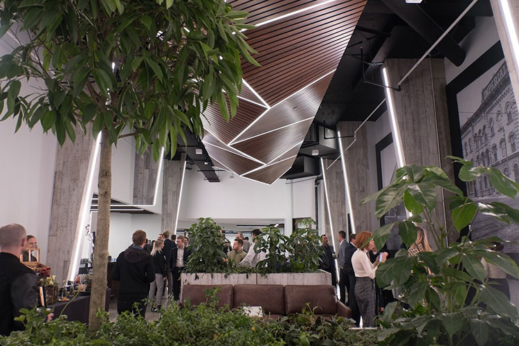 Plants and trees with people talking inside the King York Terrace venue from IQ Venues