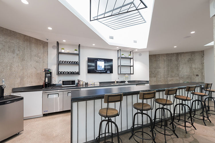 Kitchen area and bar with barstools at IQ Venues The Vault