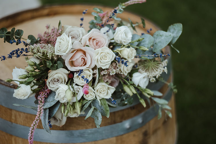 Northbrook Farm Wedding Venue - flowers on top of barrel