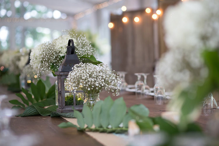 Northbrook Farm Wedding Venue - Table decor with green flowers on wood table