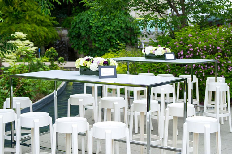 High table set up with stools outside at Toronto Botanical Gardens venue